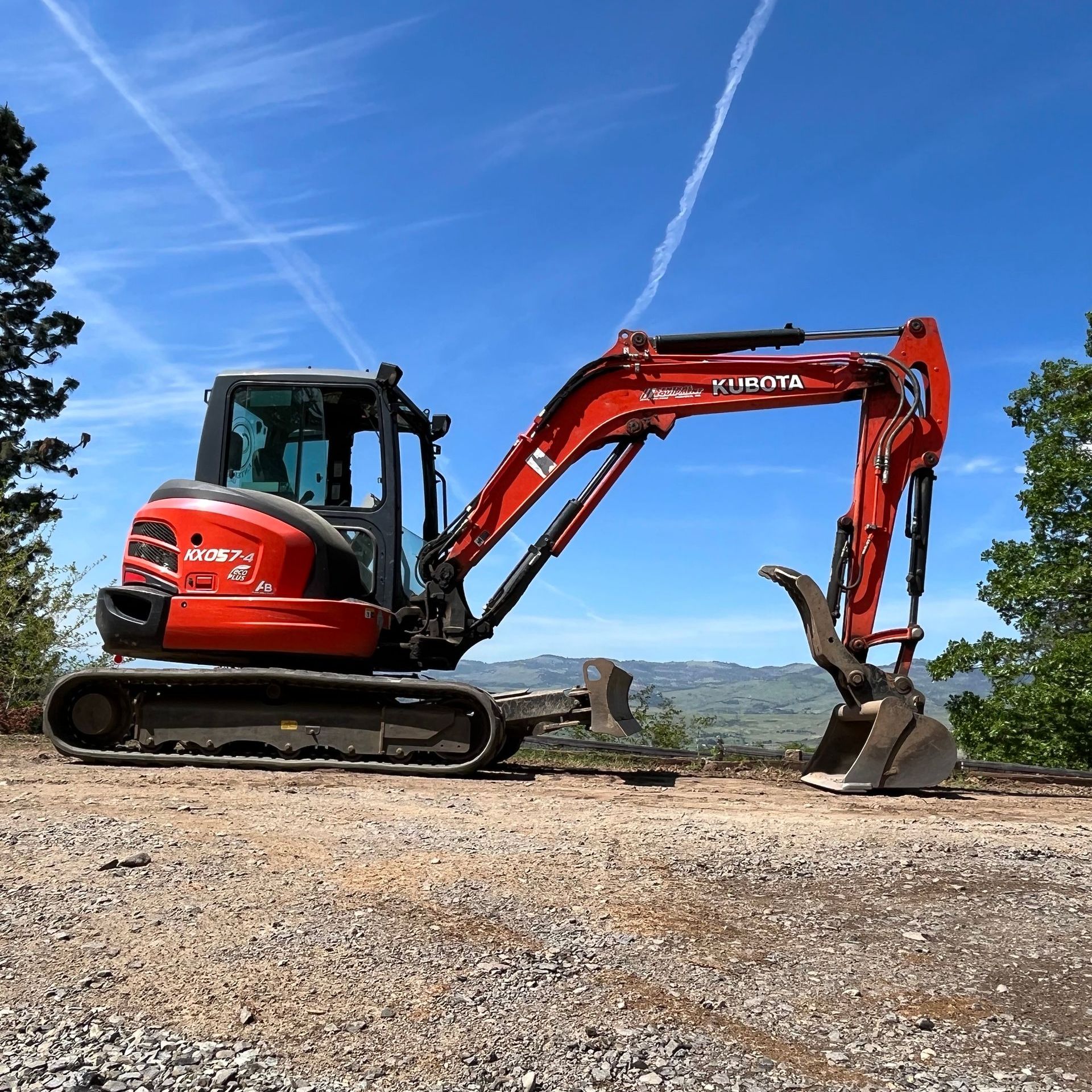 A red excavator parked in Phoenix, Oregon.