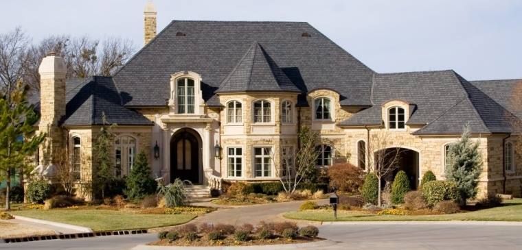 A very large house with a black roof