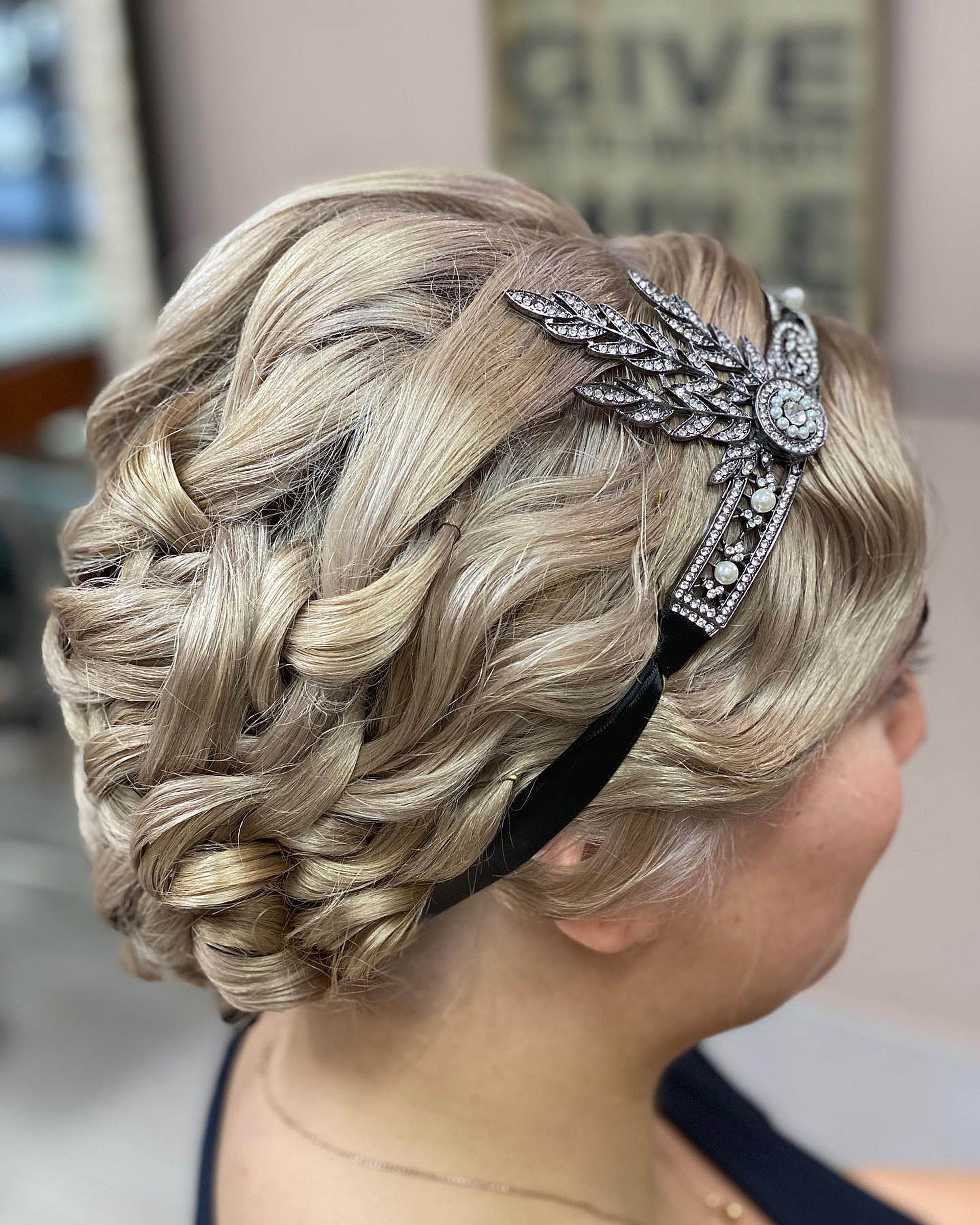 A Woman has flowers in her styled hair — Instyle Hair on B in Berserker, QLD