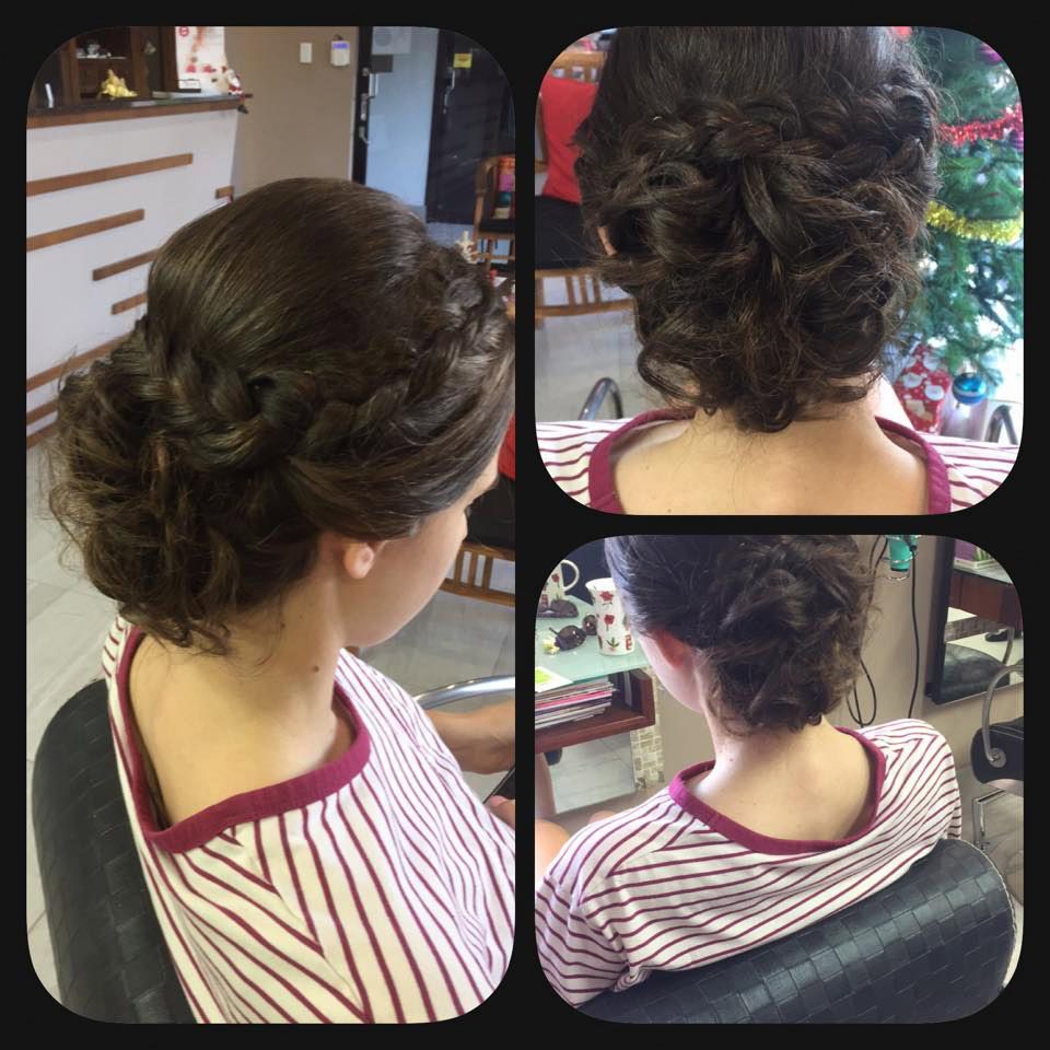A Woman in a Striped Shirt Has Her Hair in a Bun — Instyle Hair on B in Berserker, QLD