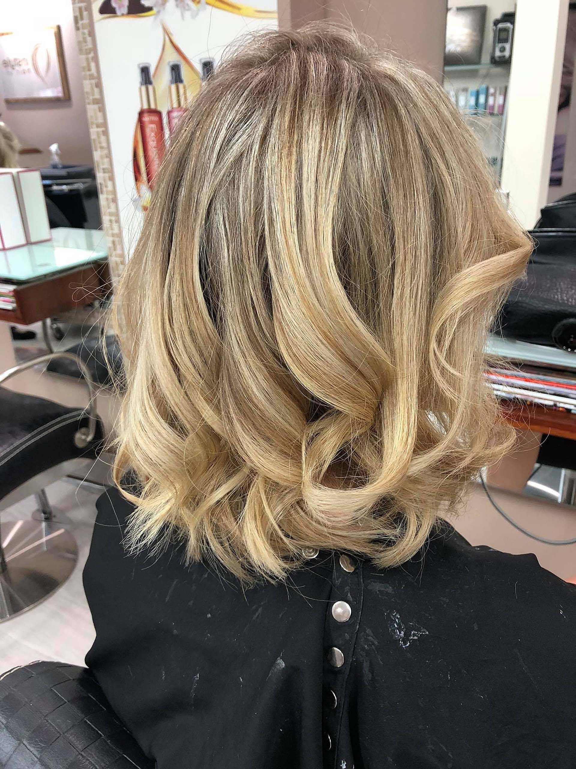 A Woman is Getting Her Hair Cut in a Salon — Instyle Hair on B in Berserker, QLD