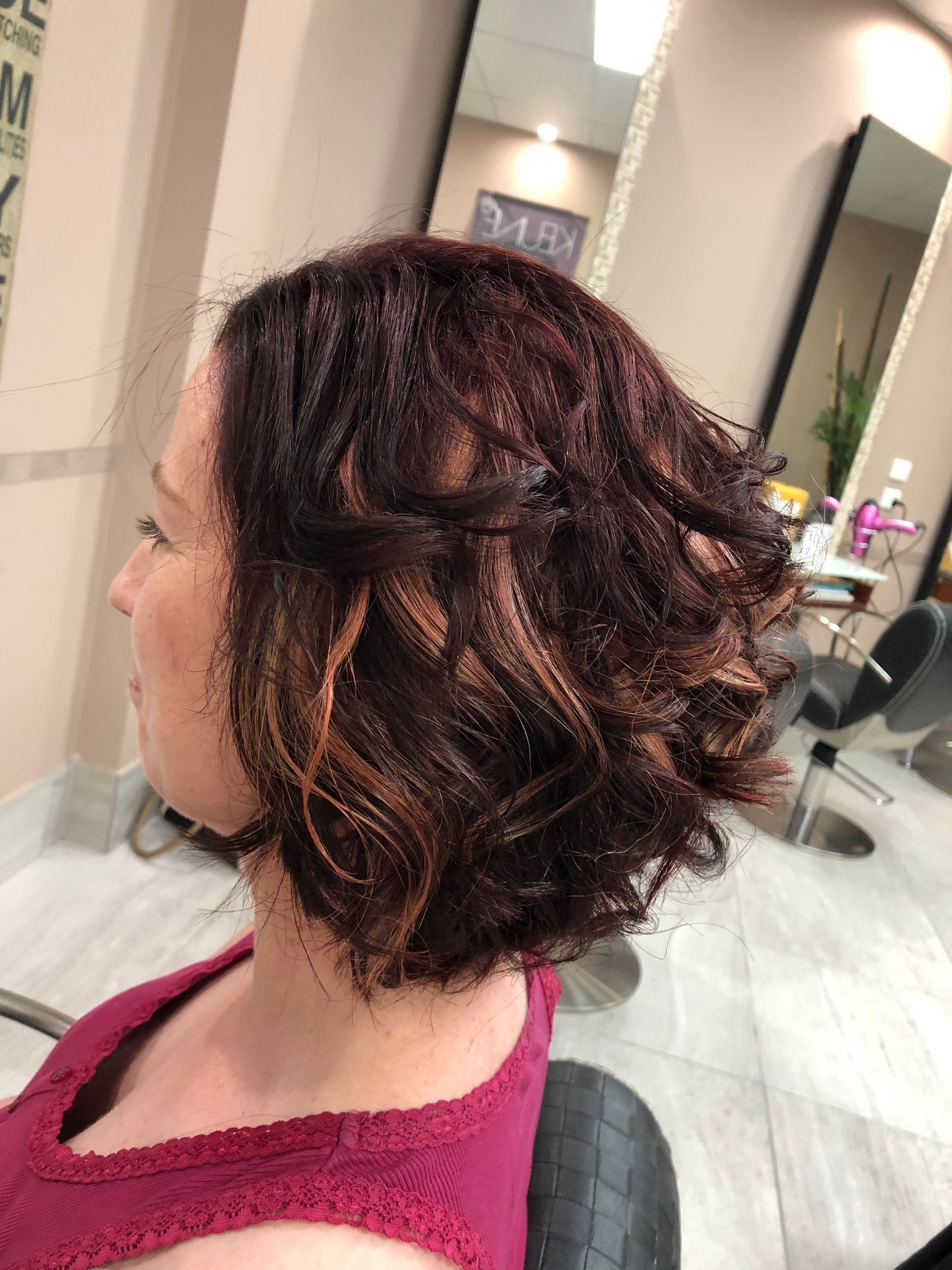 A Woman after her Hair has been done in a salon — Instyle Hair on B in Berserker, QLD