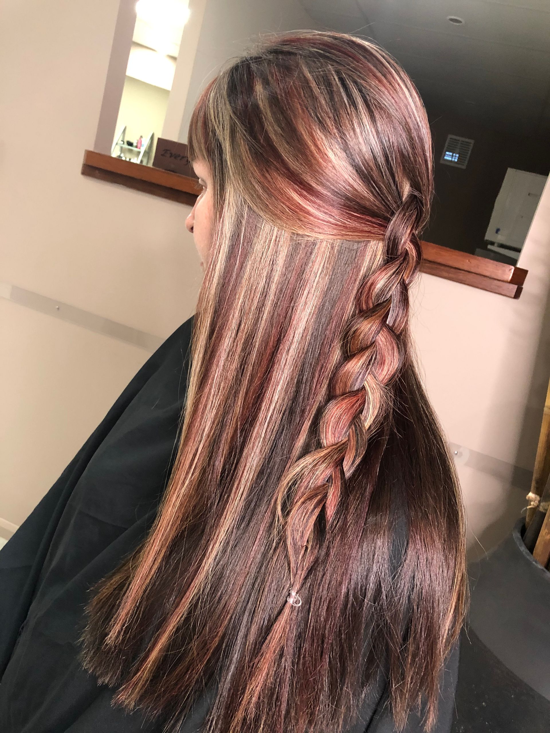 A Woman  is with Red, Brown & Blonde hair with a plait  in a Salon — Instyle Hair on B in Berserker, QLD