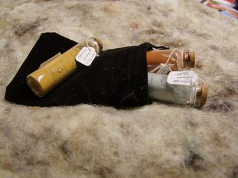 Glass Vials of studio made pigments are sent to you in velvet pouches lovingly wrapped in sheep's wool instead of bubble wrap