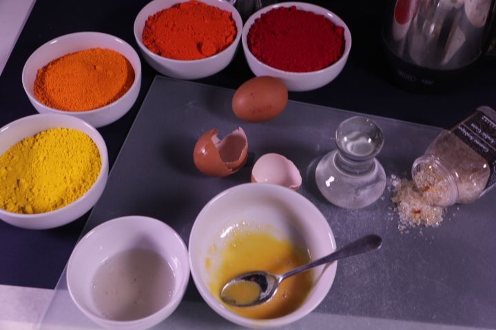 Making Egg Tempera by mixing water to egg yolk to make an emulsion