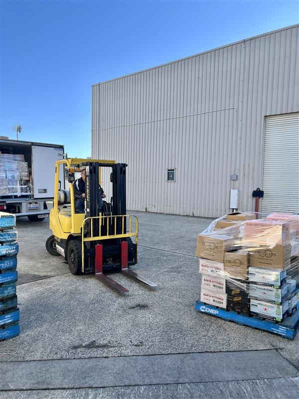 Man Is Driving A Forklift With Goods — Scotto's Food Logistics in Mitchell, ACT