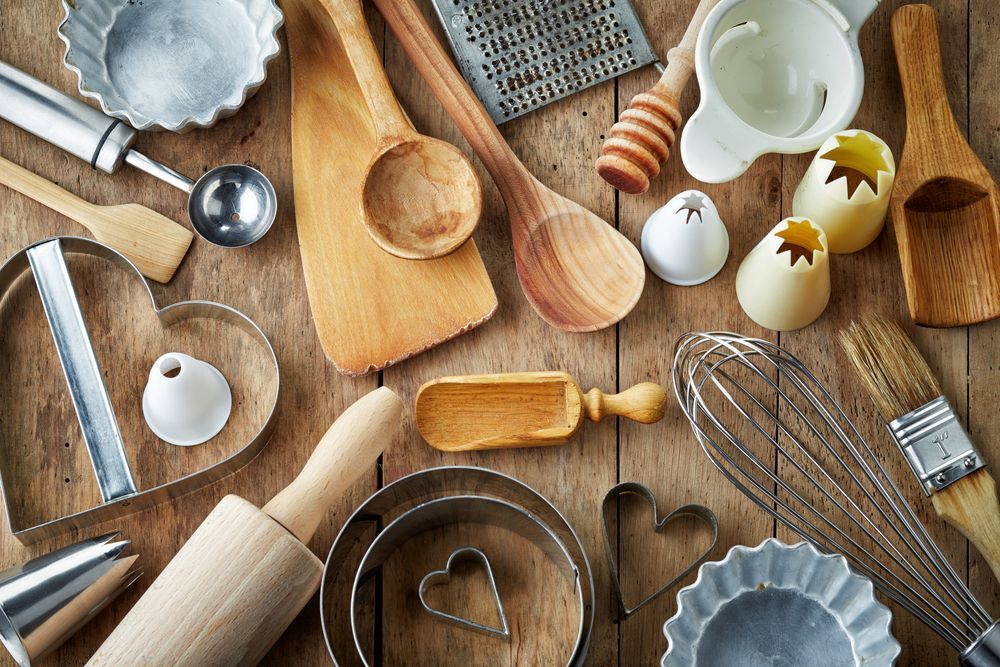 A Wooden Table Topped With a Variety of Kitchen Utensils — Scotto's Food Logistics in Mitchell, ACT