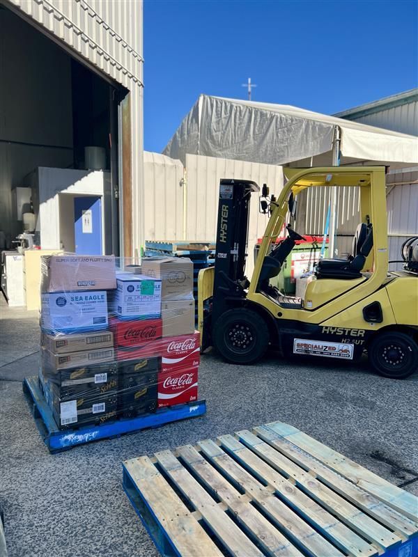 Boxes of Good on a Pallet with a Forklift - Scotto's Food Logistics in Mitchell, ACT