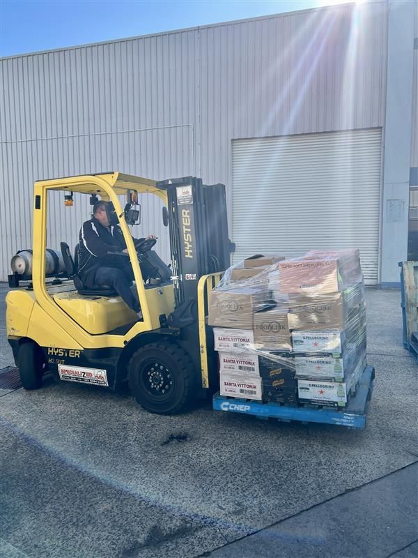 Boxes of Goods Being Moved On a Forklift — Scotto's Food Logistics in Mitchell, ACT
