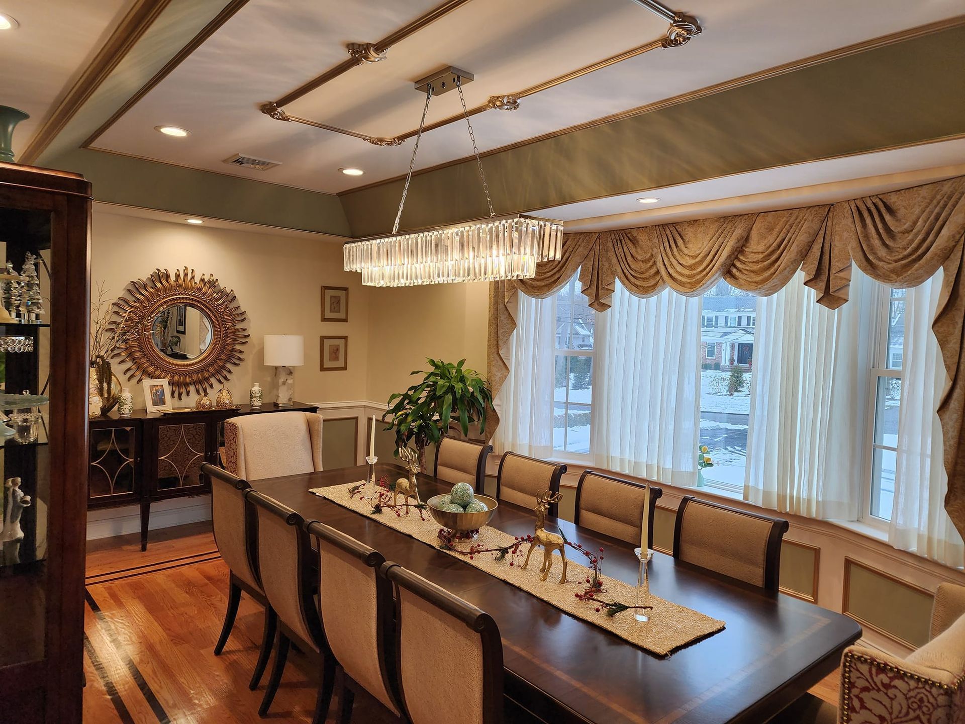 a dining room with a long table and chairs