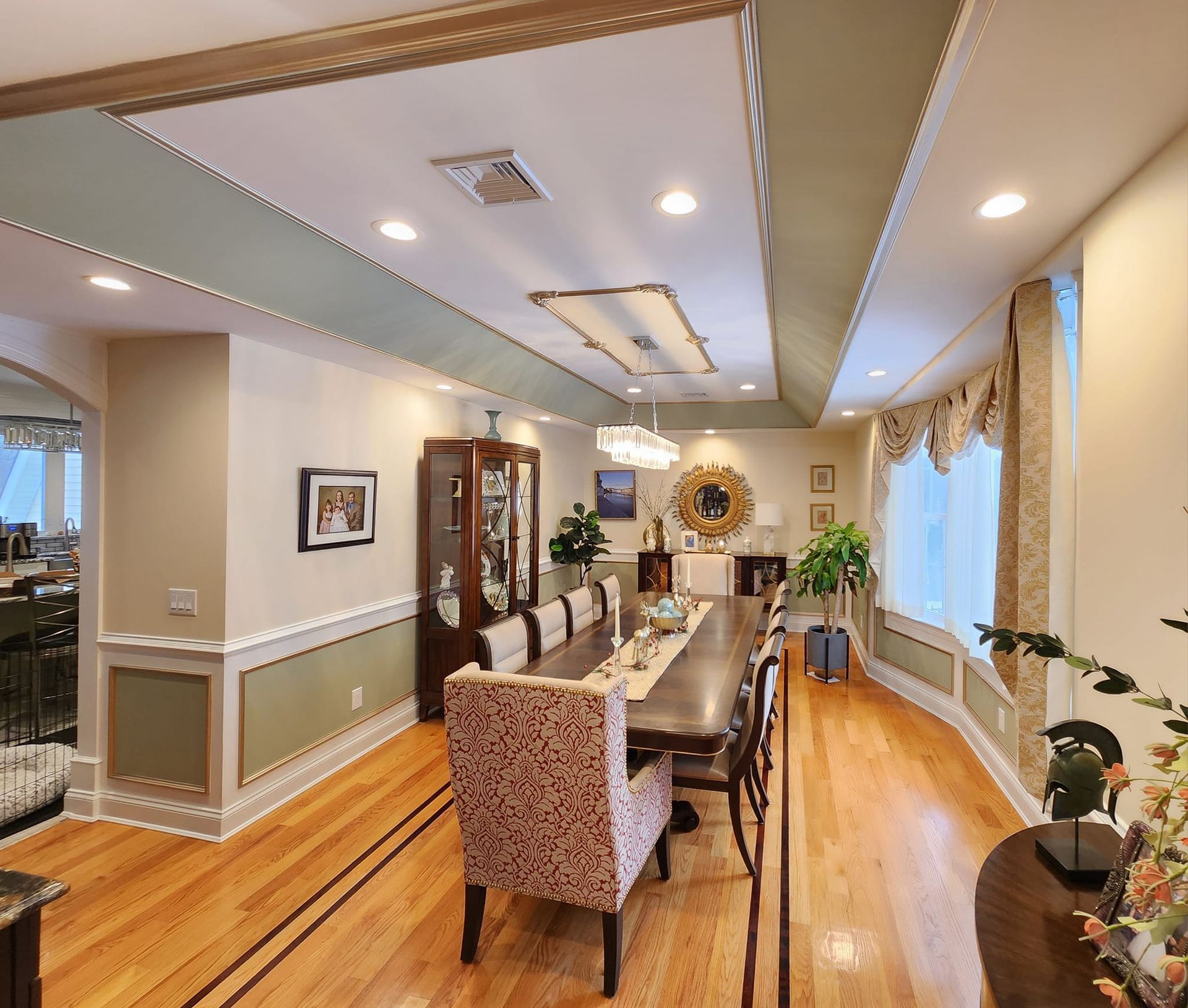 a dining room with a long table and chairs