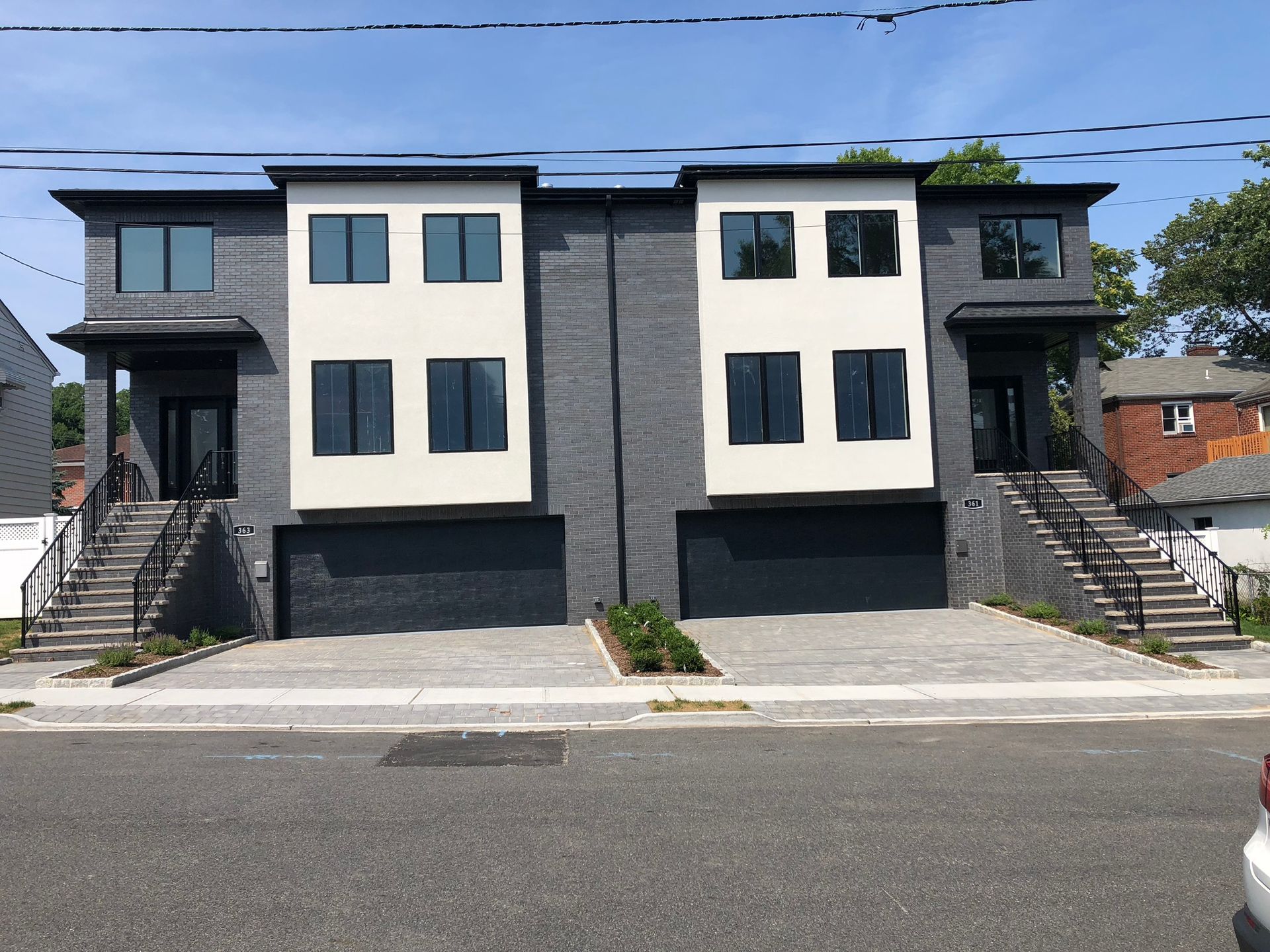 a group of engineers are looking at a blueprint on a table .