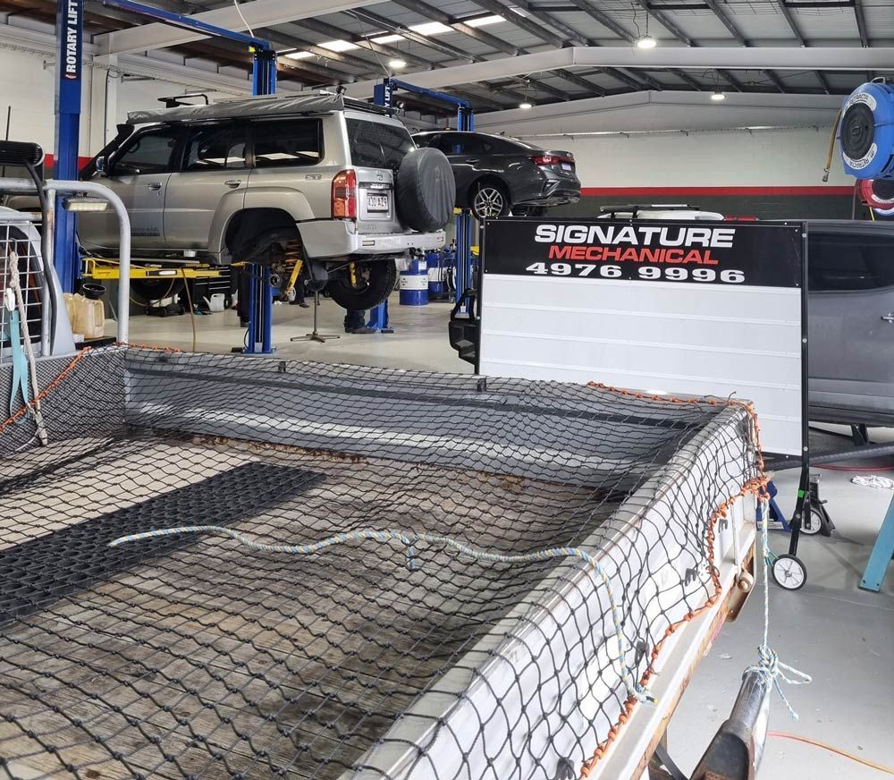 Vehicles in A Garage for Inspection