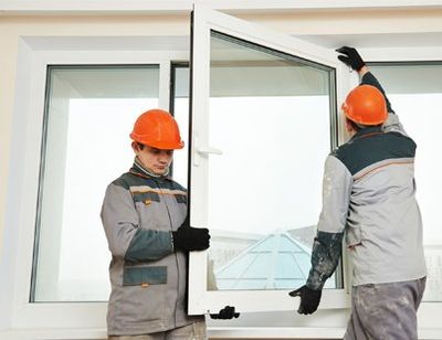 Window Installation — Two Workers Installing New Window in Augusta, GA