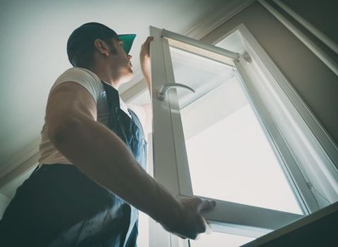 Window Contractors — Worker Installing Window in Augusta, GA