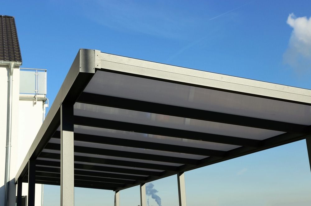 Grey Carport With Black Beams, Under a Bright Blue Sky — J&C Quality Construction in Southern Highlands, NSW