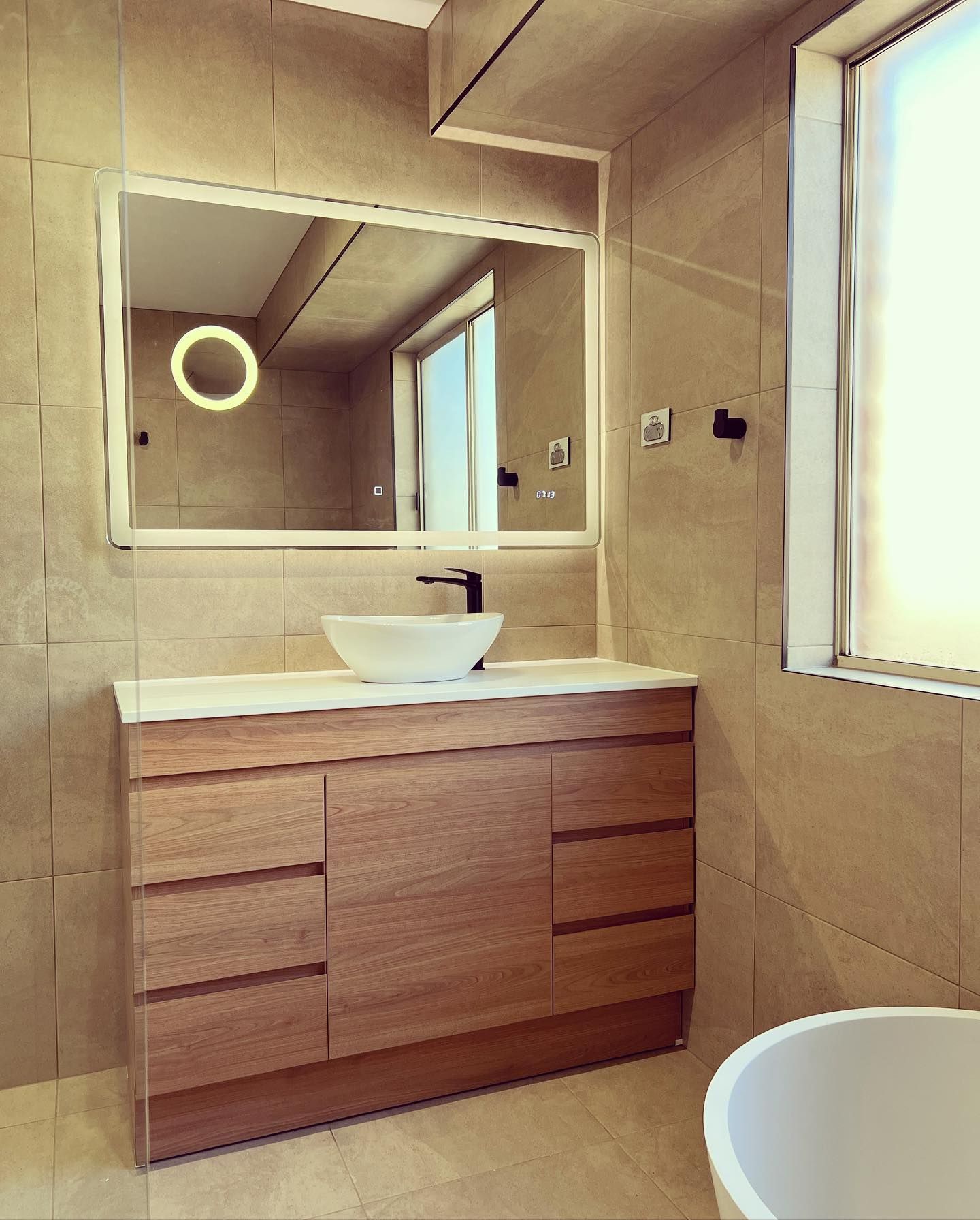 Modern Bathroom With a Wooden Vanity — J&C Quality Construction in Goulburn, NSW