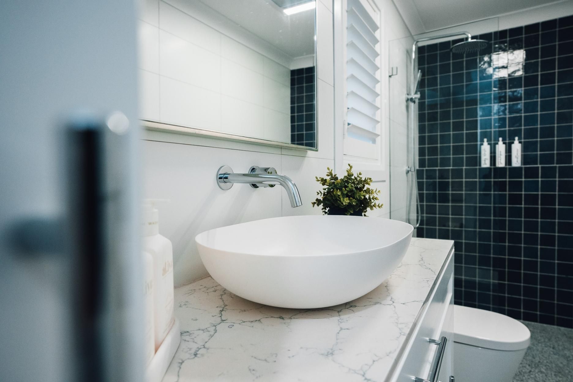 Bathroom With White Sink, Marble Countertop — J&C Quality Construction in Goulburn, NSW