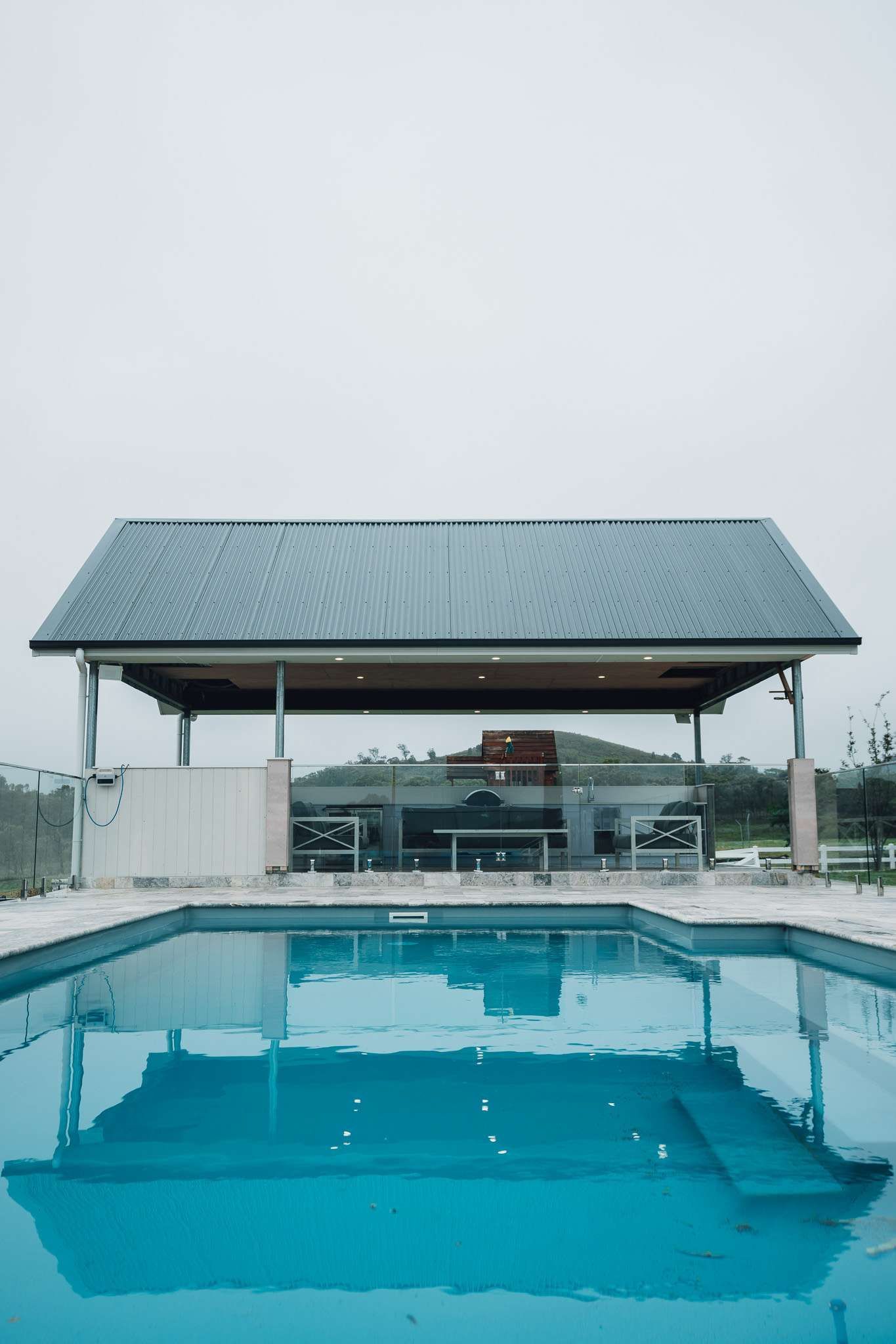 A Large Swimming Pool With A Gazebo  — J&C Quality Construction in Goulburn, NSW