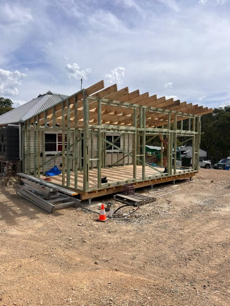 Construction Site With Wooden Frame Addition to Existing Building — J&C Quality Construction in Goulburn, NSW