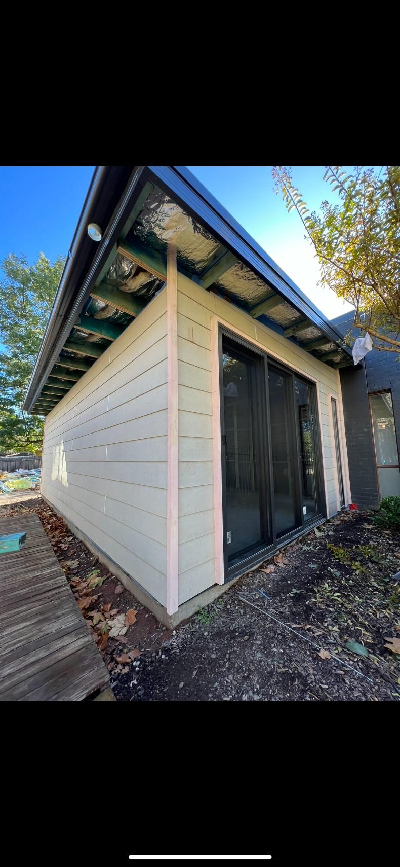 Exterior View of a Light-coloured Building With Dark Roof — J&C Quality Construction in Goulburn, NSW