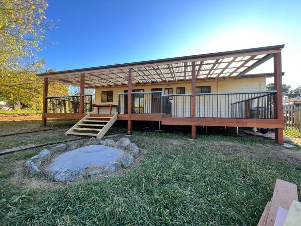 A Wooden Deck With a Covered Patio — J&C Quality Construction in Goulburn, NSW