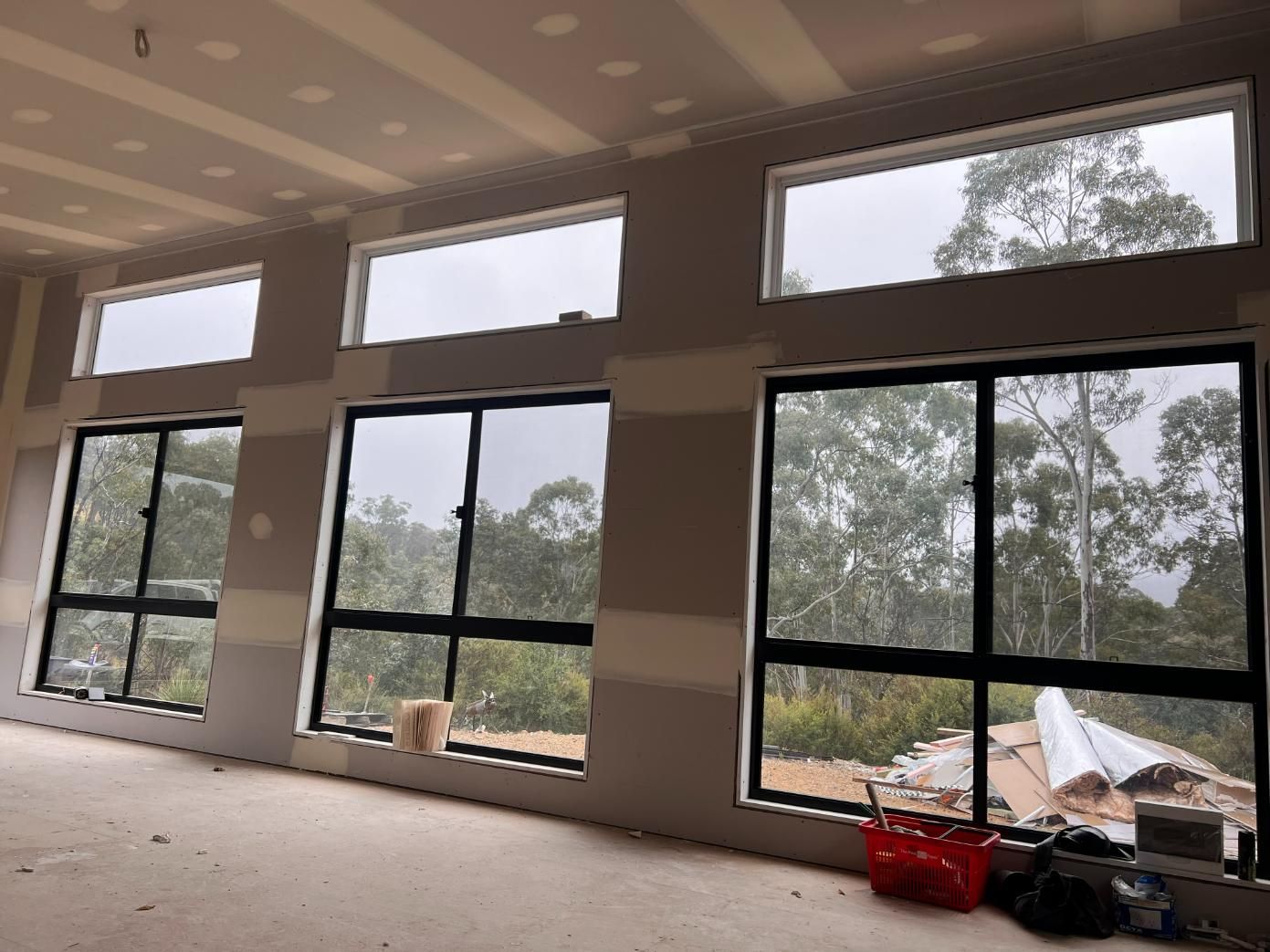 Interior View of a Room With Three Large Windows — J&C Quality Construction in Goulburn, NSW