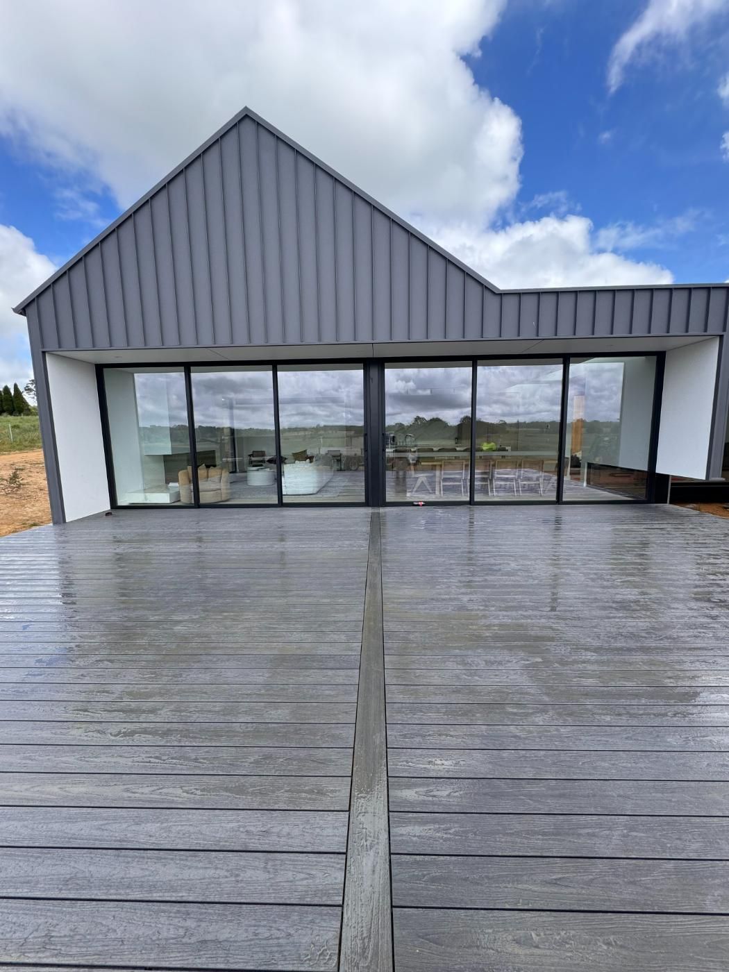 Modern Grey House With Large Glass Windows — J&C Quality Construction in Goulburn, NSW