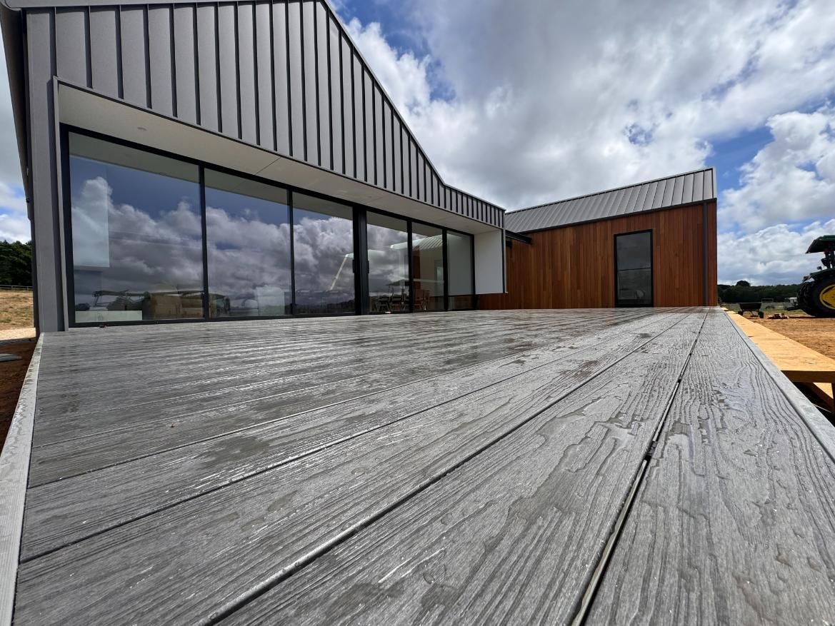 Grey Composite Deck Leading to a Modern House — J&C Quality Construction in Goulburn, NSW