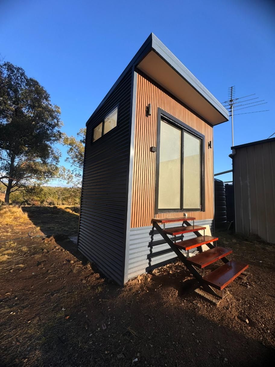 Tiny House With Wooden Steps — J&C Quality Construction in Goulburn, NSW