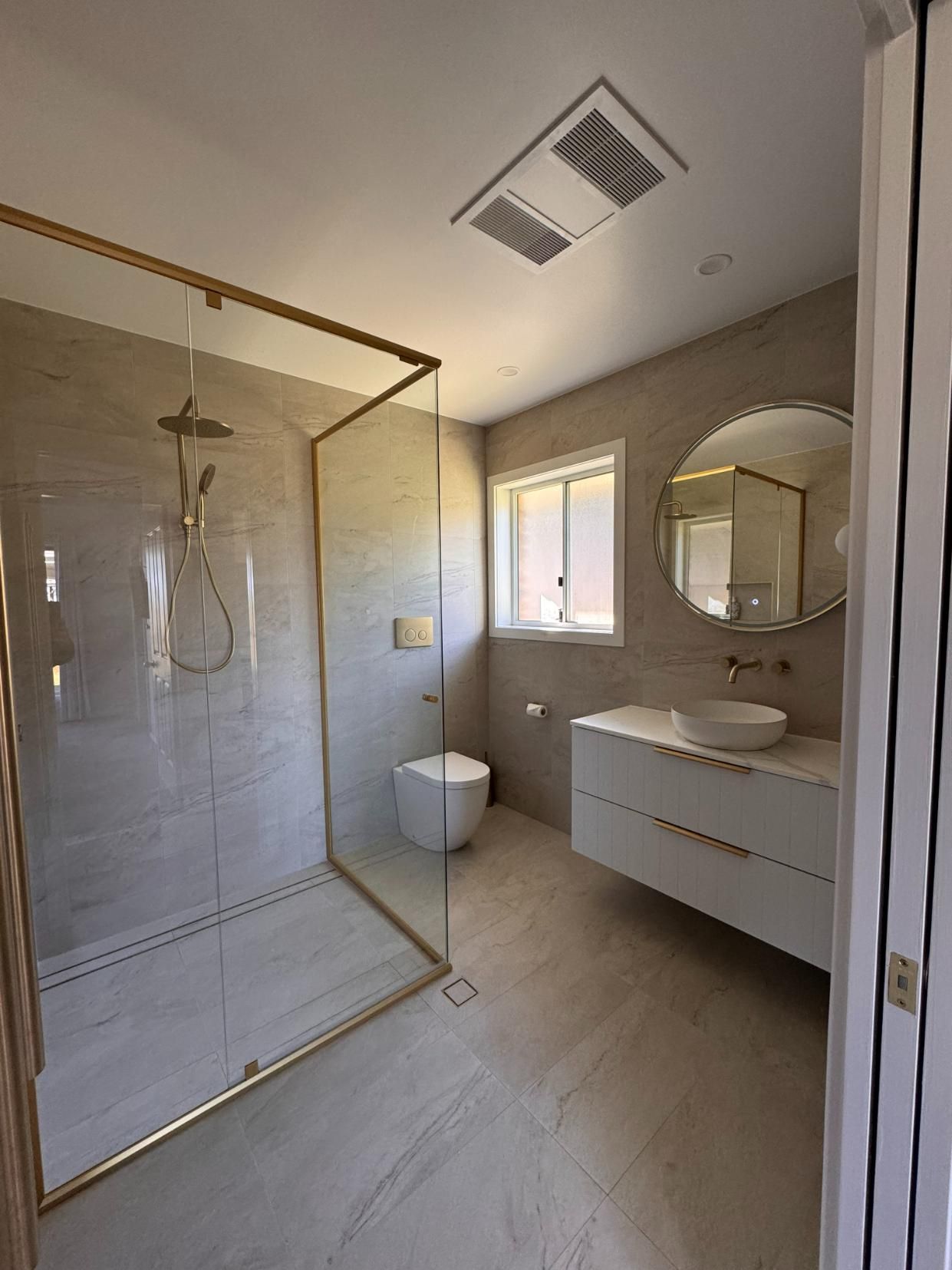 Modern Bathroom With Gold-framed Shower — J&C Quality Construction in Goulburn, NSW