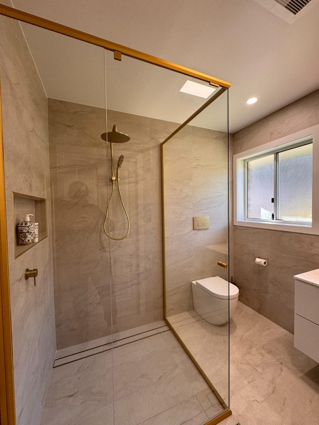 Modern Bathroom With a Glass Shower Enclosure — J&C Quality Construction in Goulburn, NSW