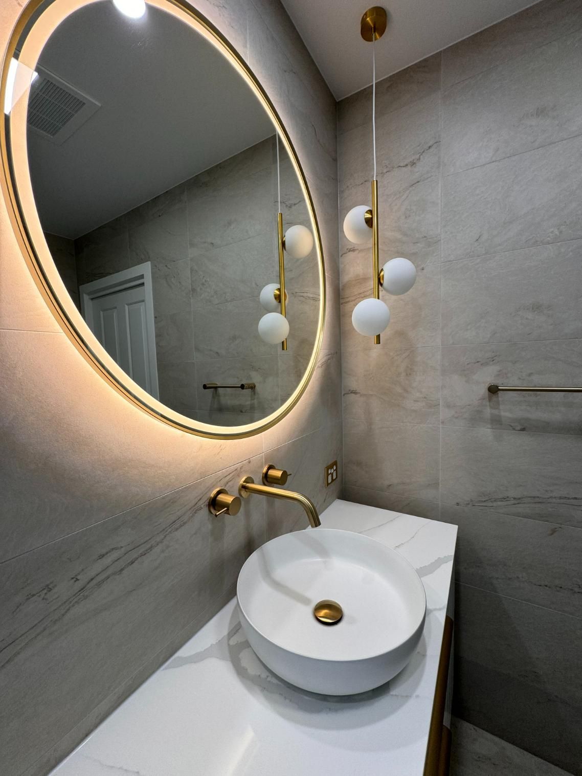 Modern Bathroom With a Gold-framed — J&C Quality Construction in Goulburn, NSW