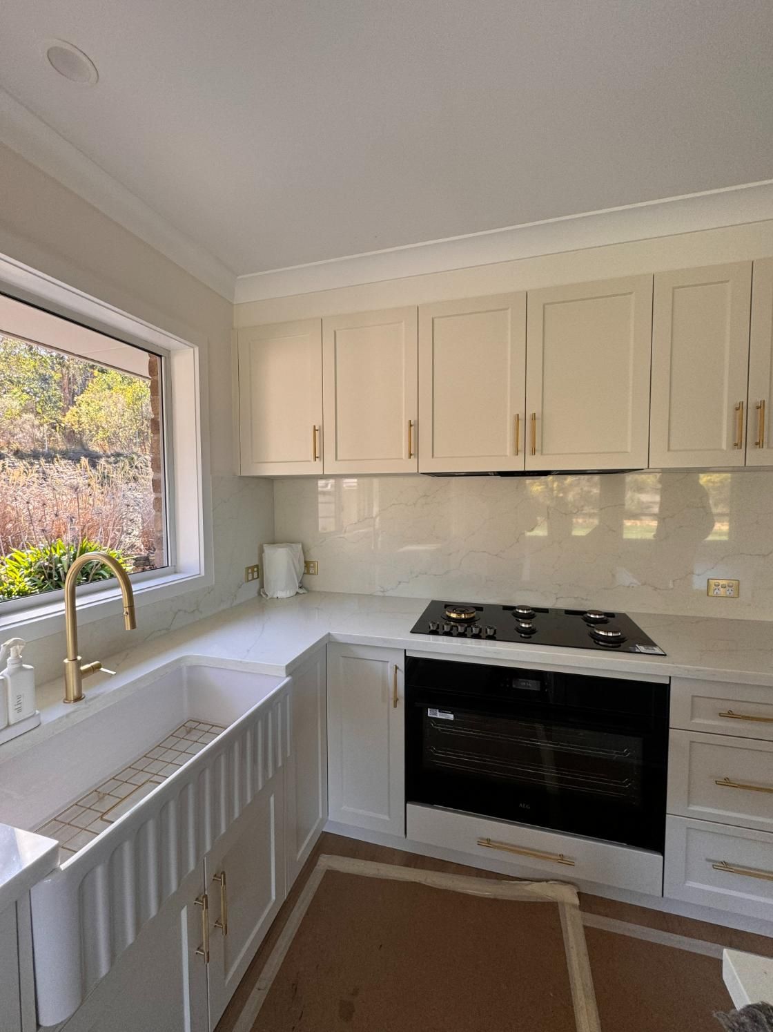 White Kitchen With Farmhouse Sink — J&C Quality Construction in Goulburn, NSW
