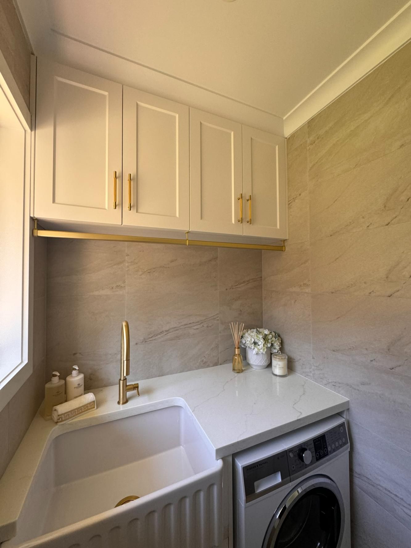 Laundry Room With White Cabinets — J&C Quality Construction in Goulburn, NSW