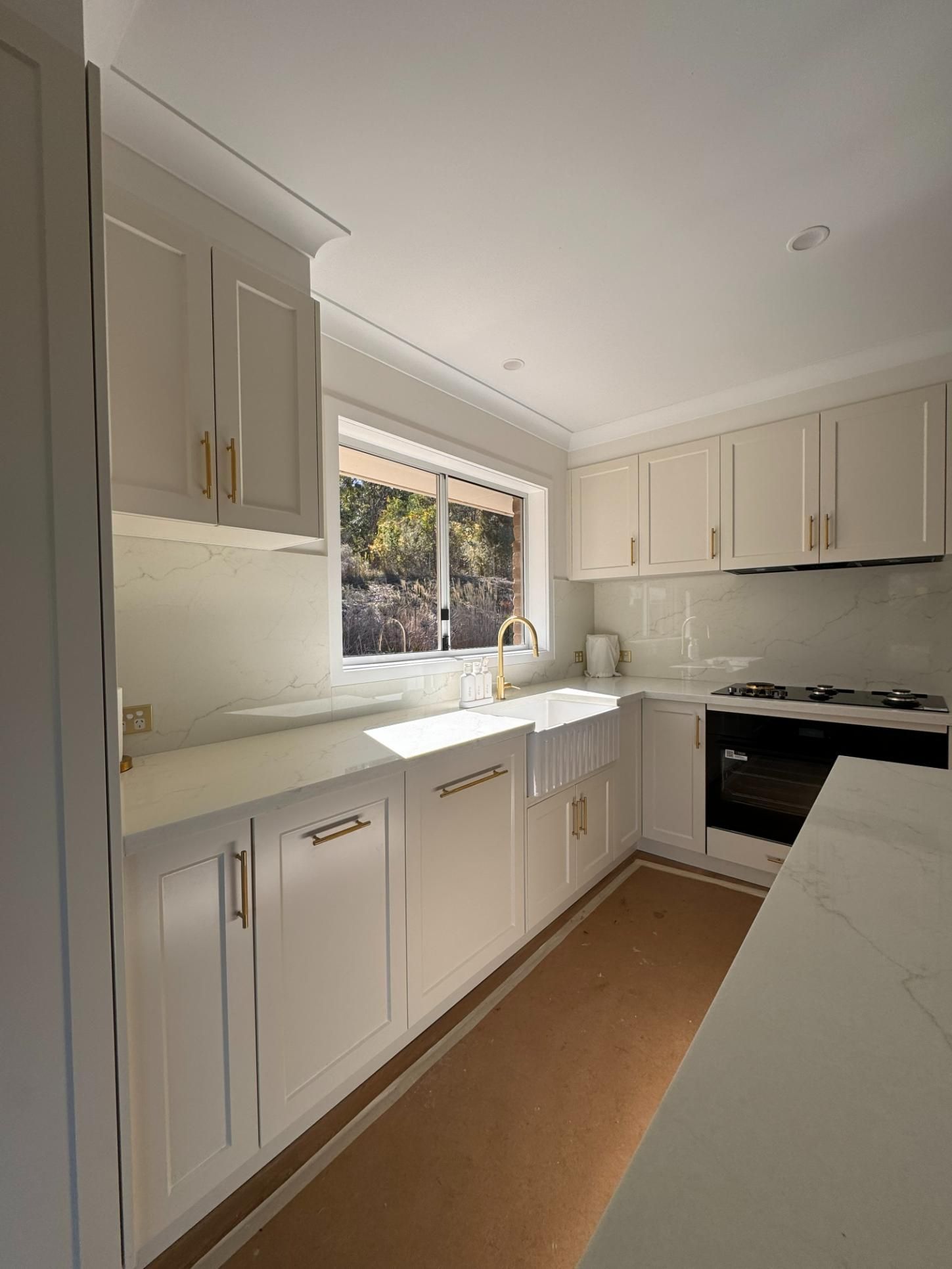 White Kitchen With Cabinets — J&C Quality Construction in Goulburn, NSW