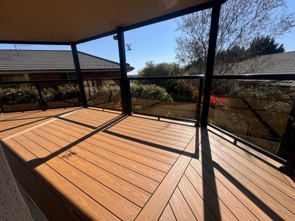 Wooden Porch With Steps Leading to a Front Door and a Window — J&C Quality Construction in Goulburn, NSW