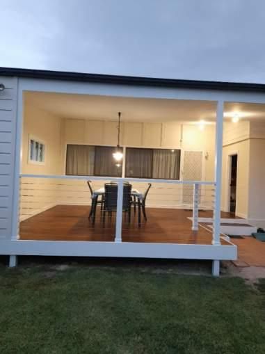 Outdoor Dining Area With a Table — J&C Quality Construction in Goulburn, NSW
