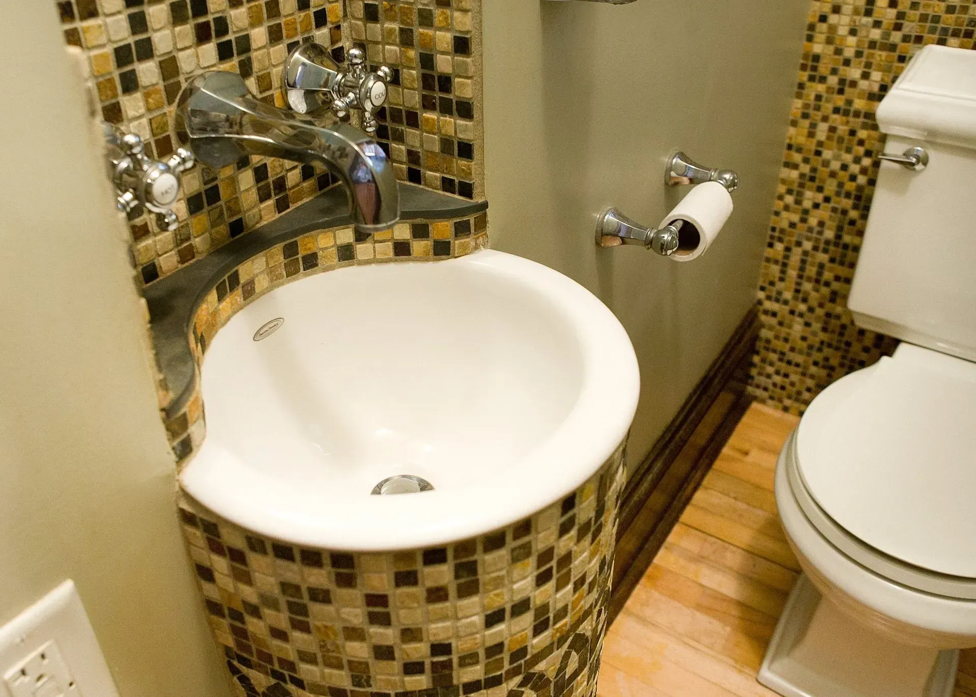 A bathroom with a toilet and a sink