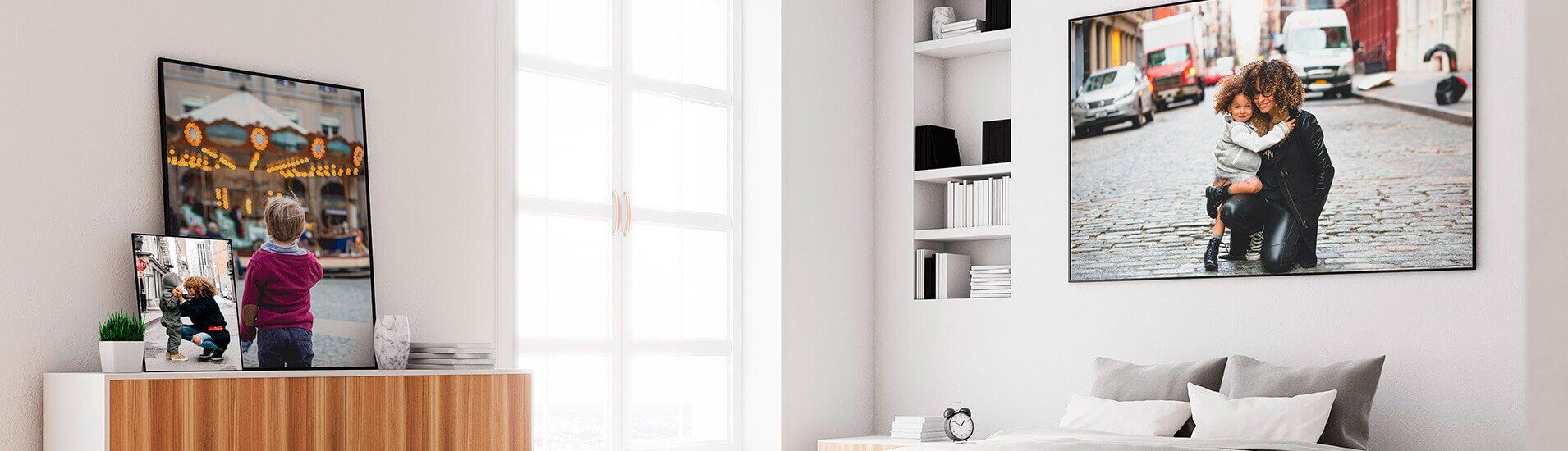 A bedroom with two paintings on the wall and a bed.