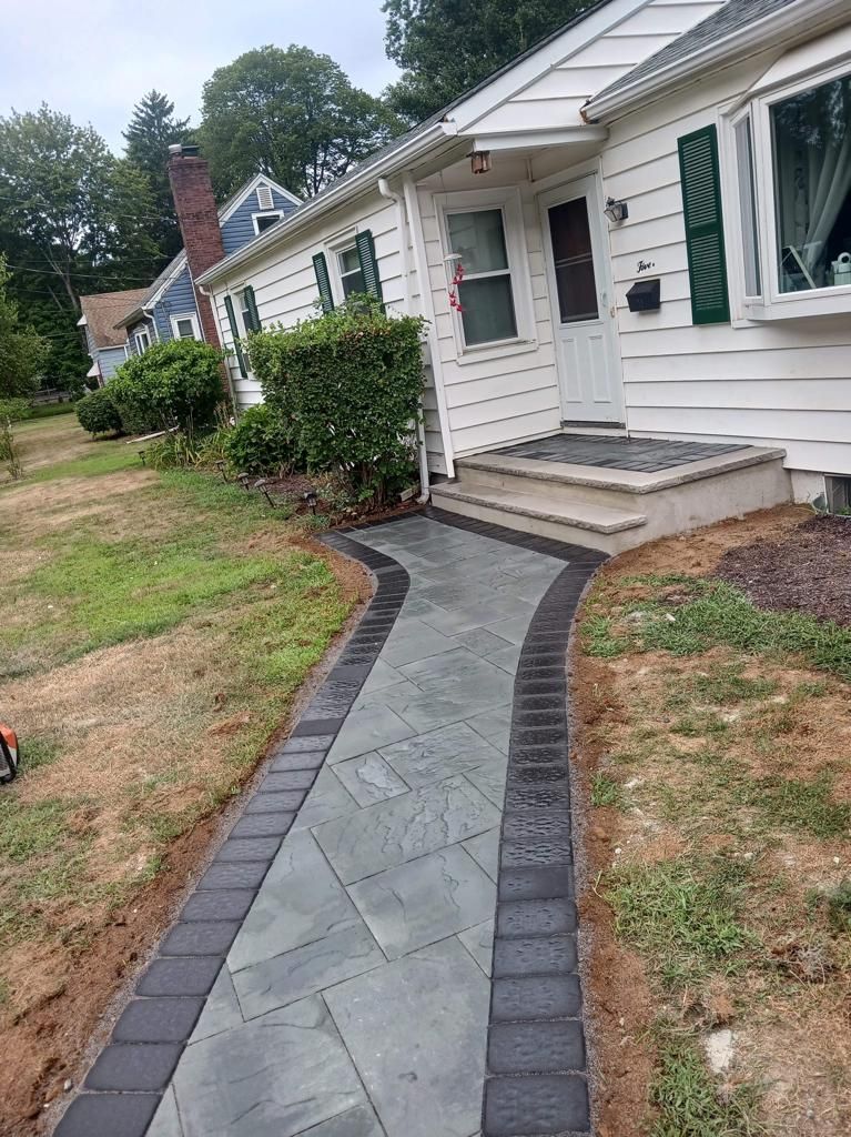 A walkway leading to the front door of a house.