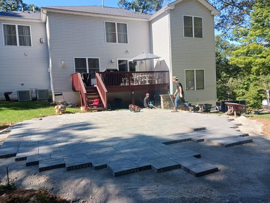 A large house with a patio in front of it
