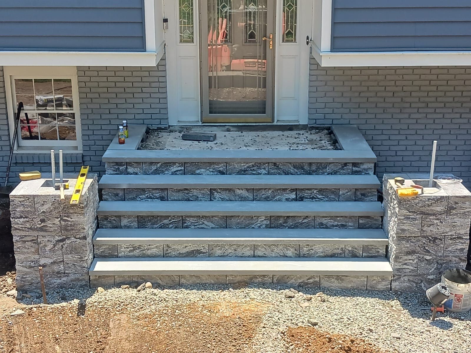The front steps of a house are being built.
