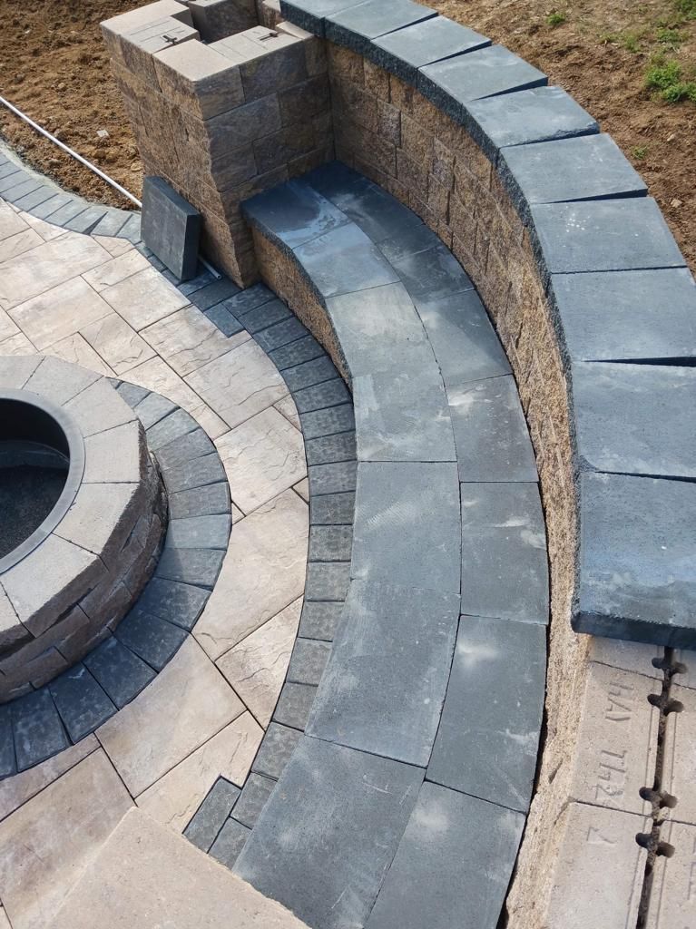 There is a fire pit in the middle of the patio.