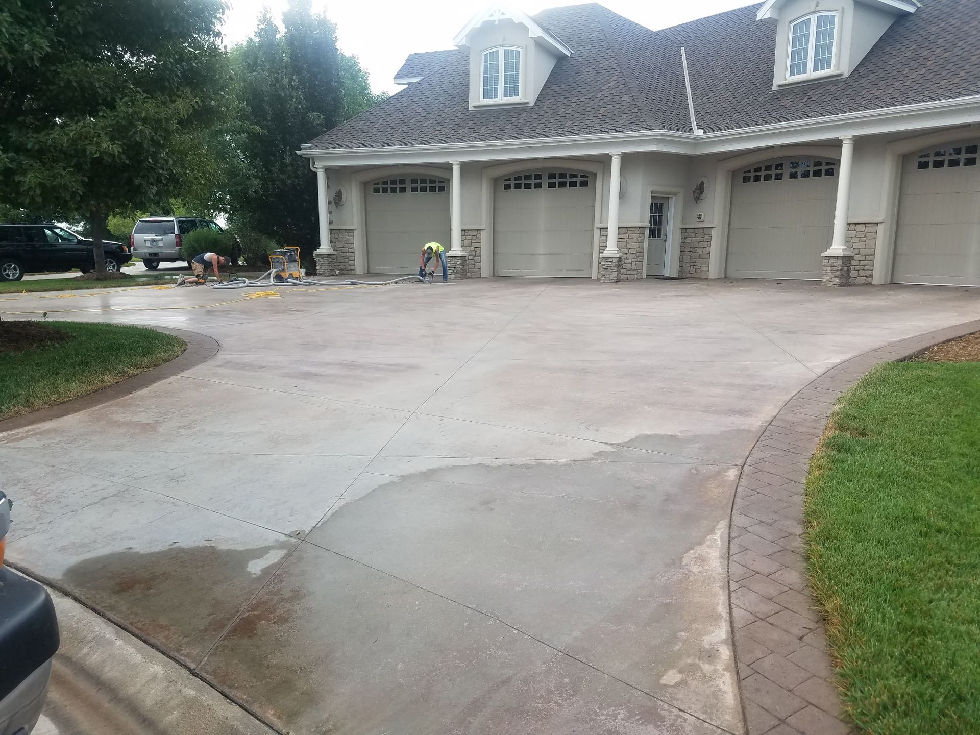 A large house with a driveway leading to it