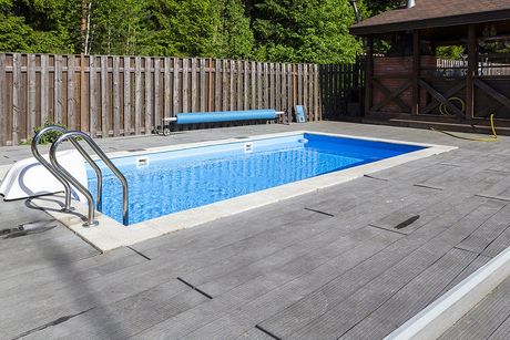 a pool with stainless steel railings