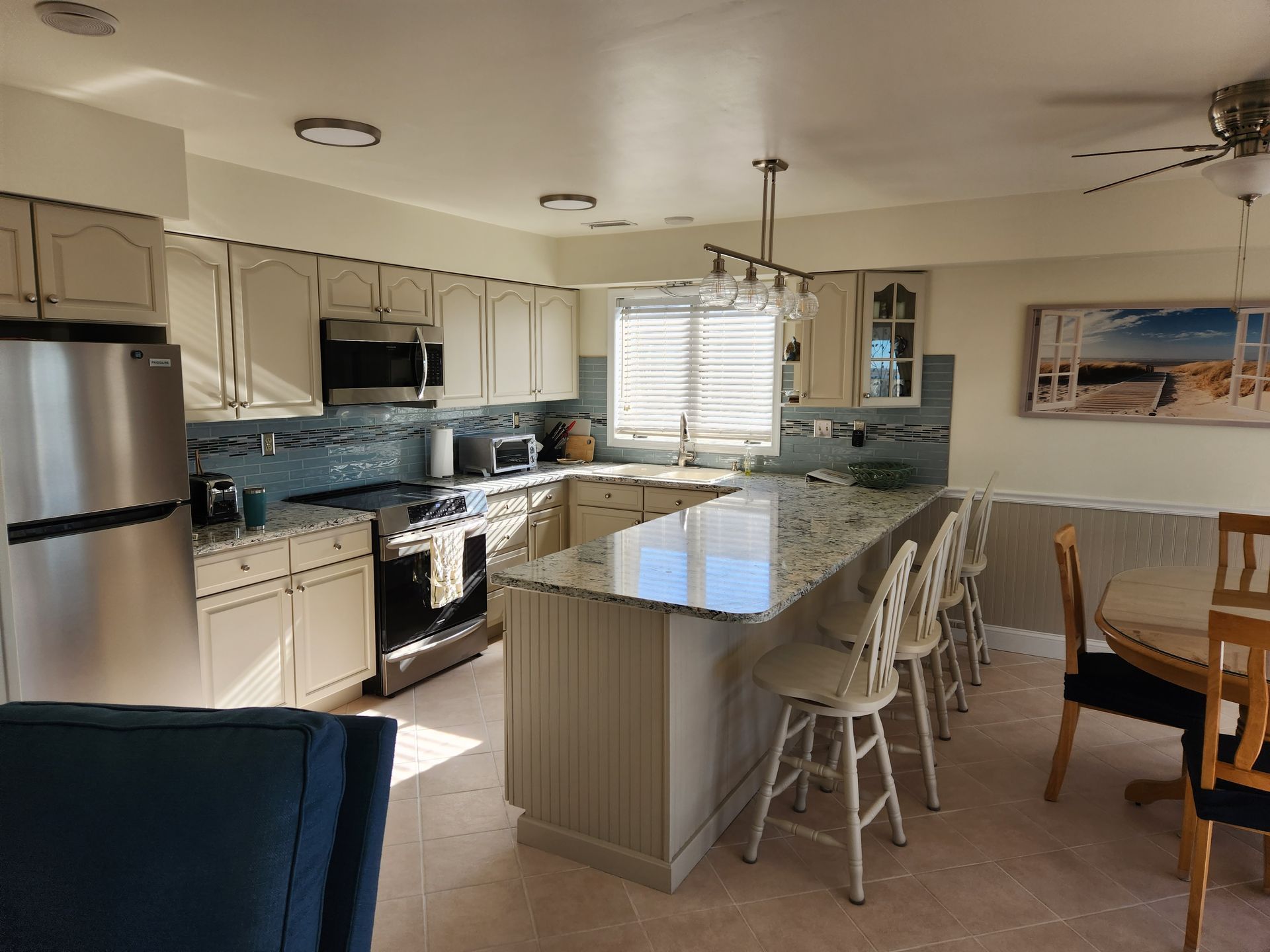 A kitchen with stainless steel appliances and granite counter tops