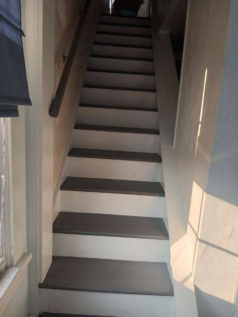 A set of stairs leading up to the second floor of a house