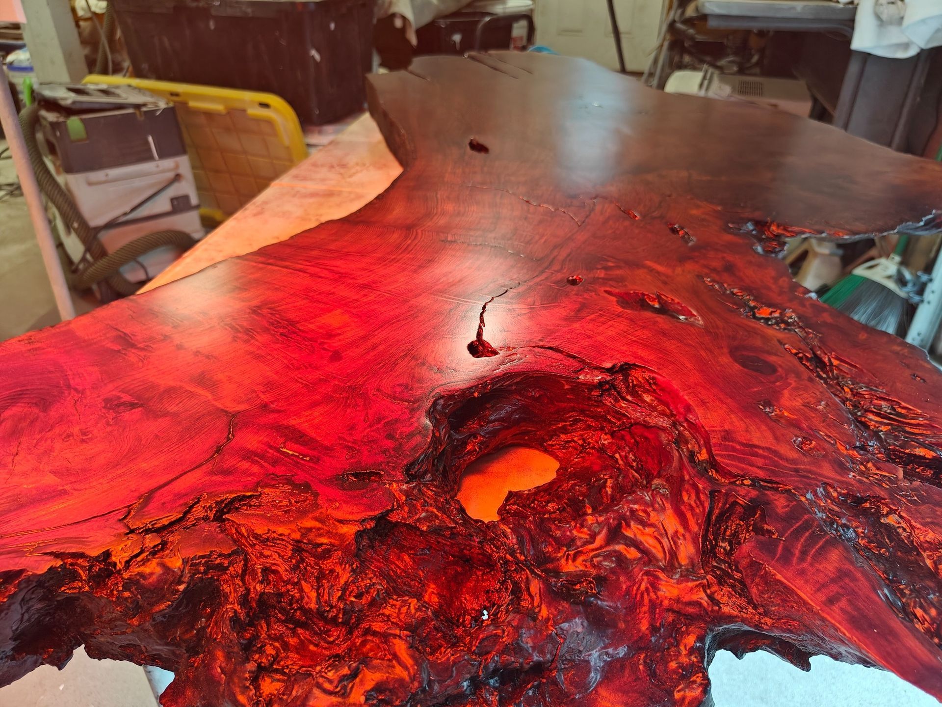 A piece of wood with a hole in it is sitting on a table.