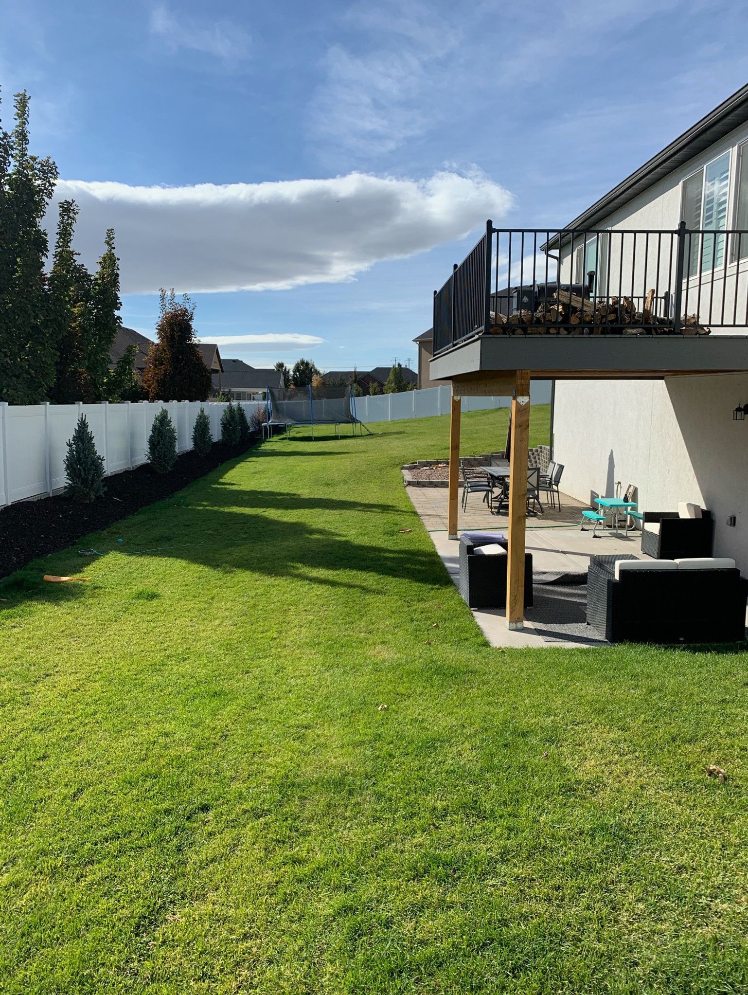A house with a large lawn in front of it